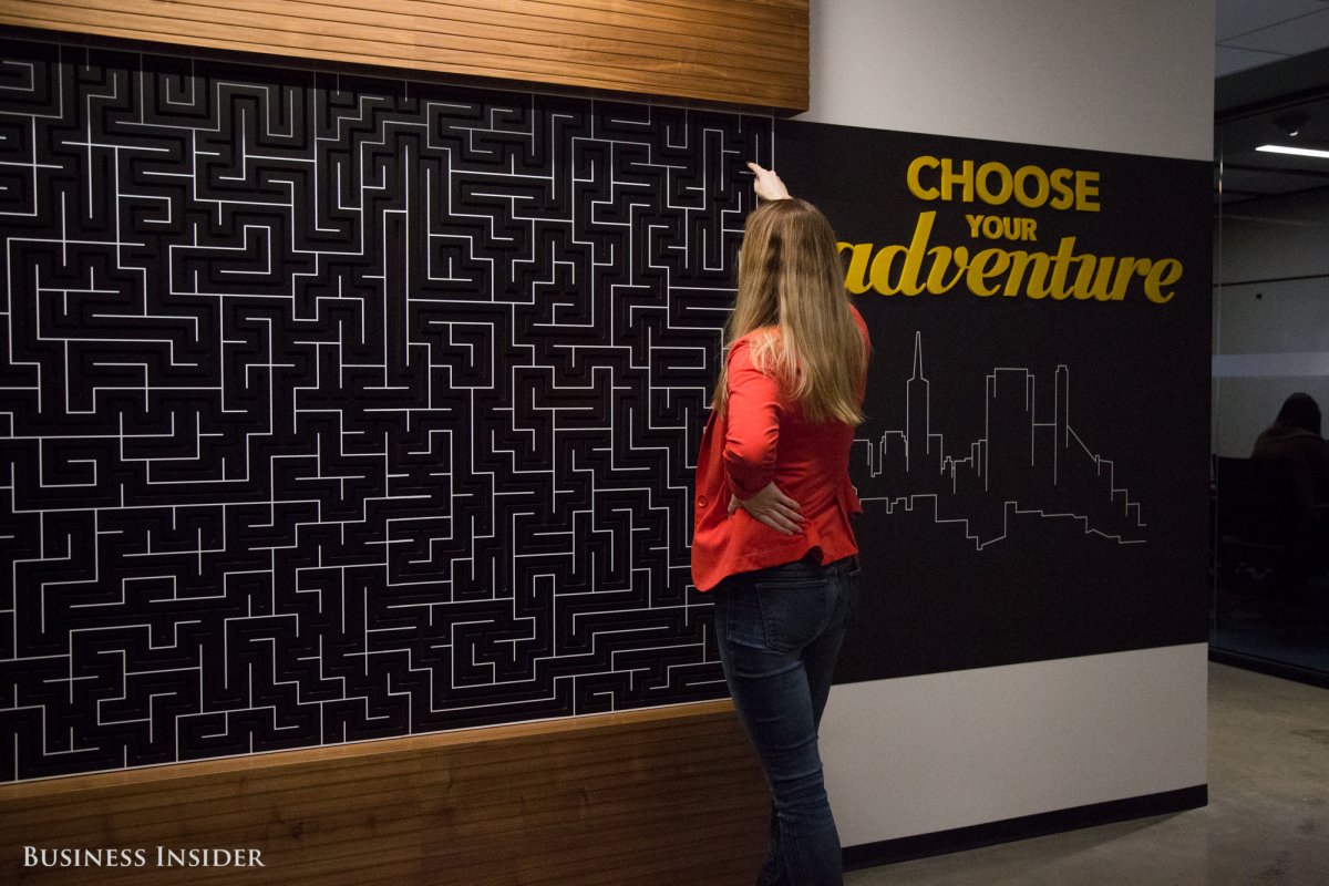 A wall inspired by the "Choose Your Own Adventure" books challenges employees to make their way through a complicated maze. It's a little dizzying to do.