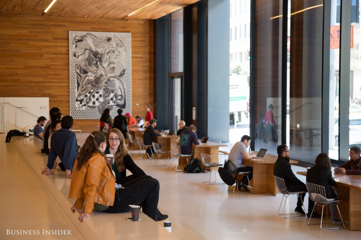 The ground floor has dozens of chairs gathered around long wooden tables, three pieces of Frank Stella artwork, and a trendy Equator Coffee bar. It's a public space, open to anybody.