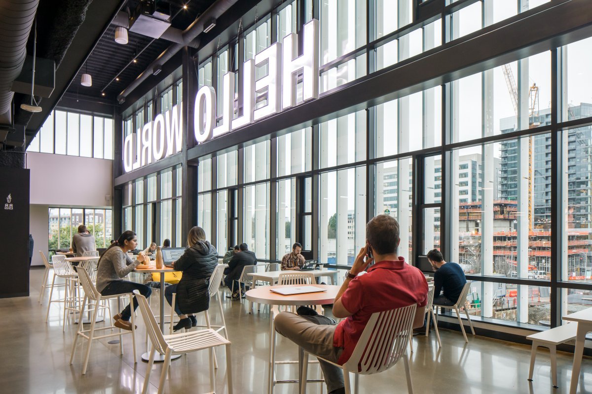 There's an airy common area for Amazonians to share a cup of coffee, featuring the backside of the "Hello World" sign.