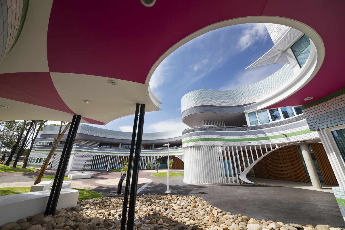 In Niddrie, Australia, the Penleigh and Essendon Grammar School features a jester-like color scheme. Sloping walls give the building a playful feel.