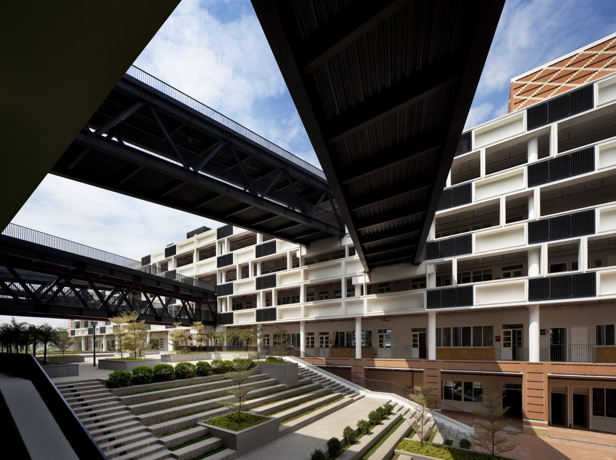  Its crisscrossing sky-walks throw cooling shadows onto the campus below. 