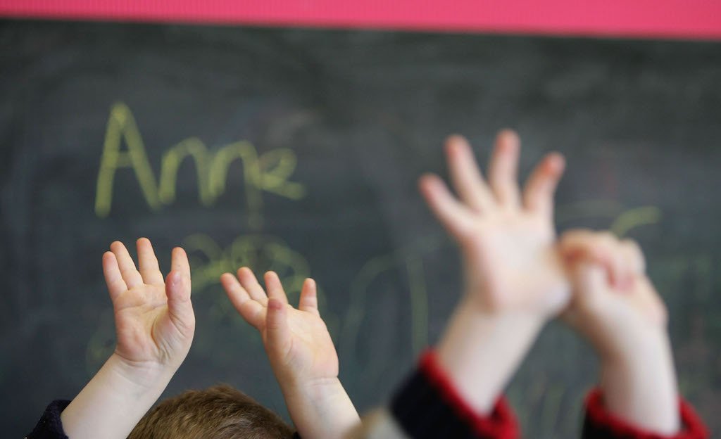 Kids raising hands