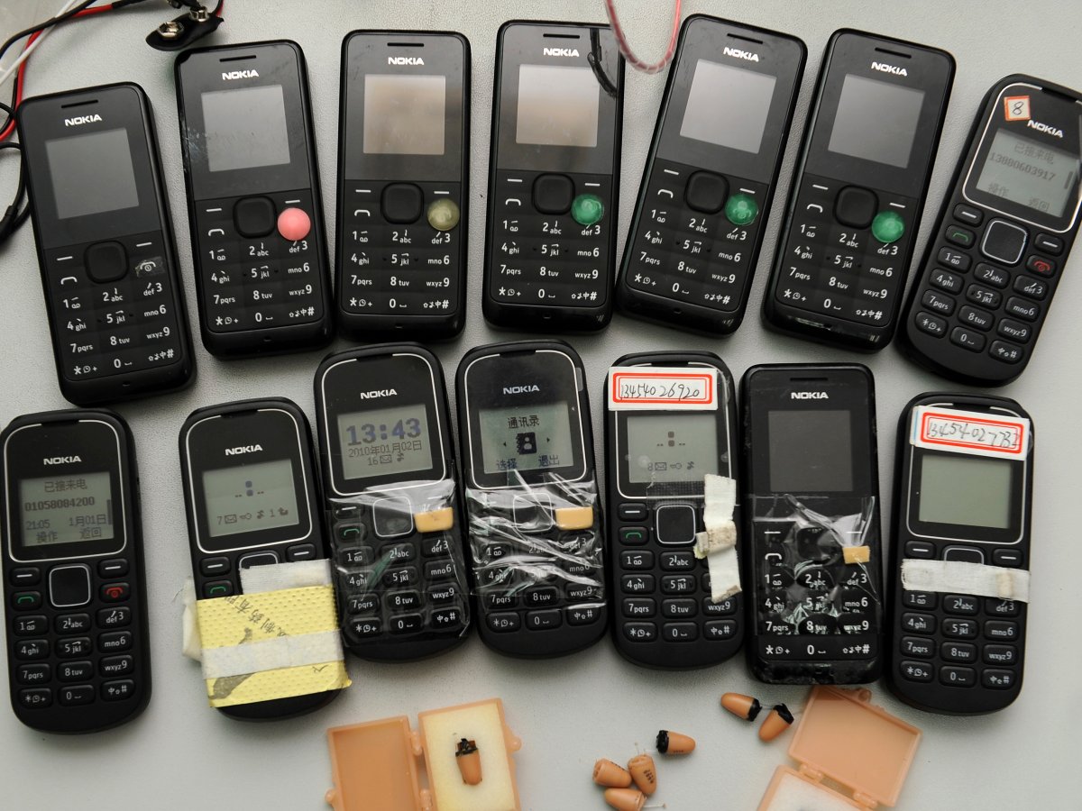 The Ministry of Education said students caught cheating would be stripped of enrollment qualifications for one to three years. Here are confiscated cell phones and receivers.