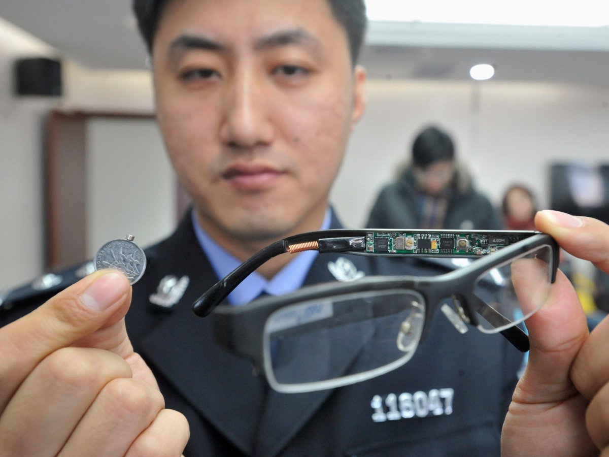 These confiscated glasses contained a hidden camera and a coin with a tiny receiver.